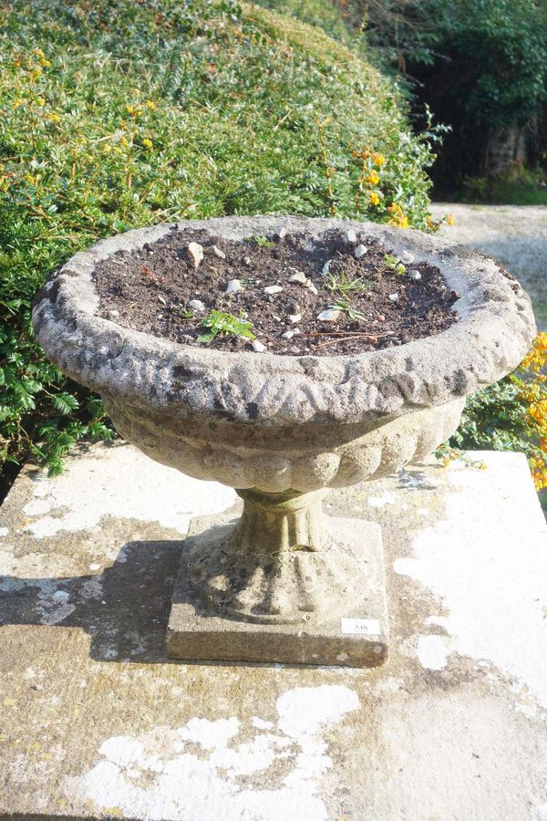 A SET OF THREE CAMPANA-SHAPED GARDEN URNS