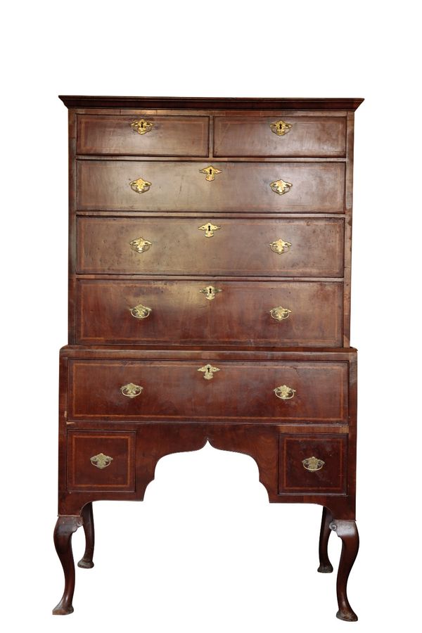 A GEORGE II STYLE WALNUT CHEST ON STAND