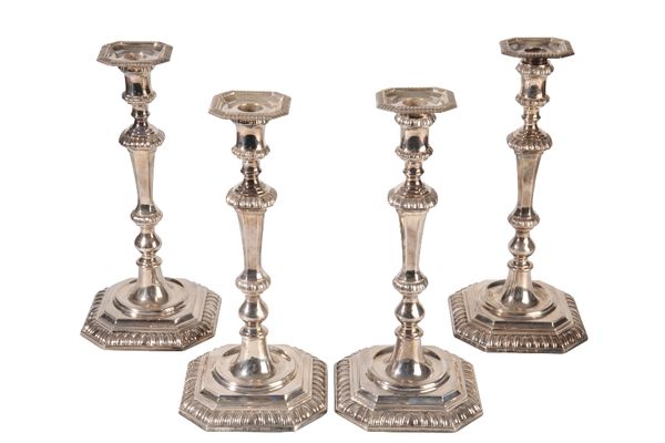 HARLEQUIN SET OF FOUR EDWARDIAN SILVER CANDLESTICKS by William Hutton & Sons Ltd