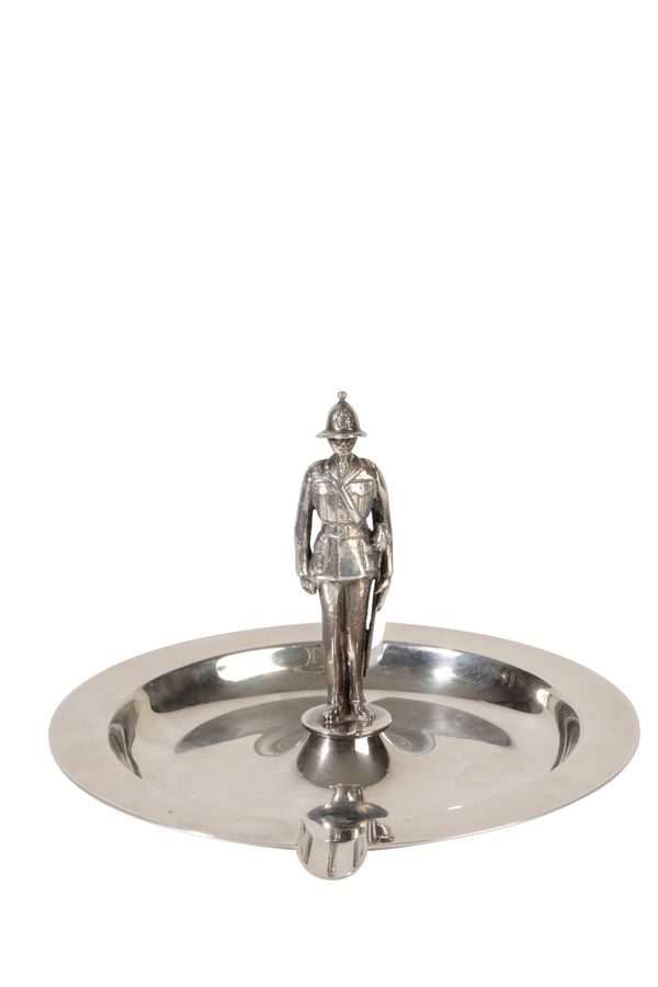 MILITARY INTEREST: A NOVELTY SILVER ASHTRAY, by Garrard & Co, London, 1958