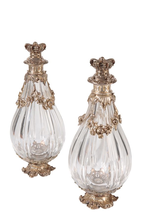 PAIR OF CONTINENTAL SILVER MOUNTED AND GLASS DECANTERS