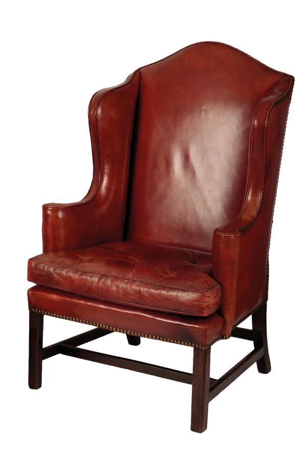 GEORGE III MAHOGANY AND LEATHER UPHOLSTERED WING ARMCHAIR