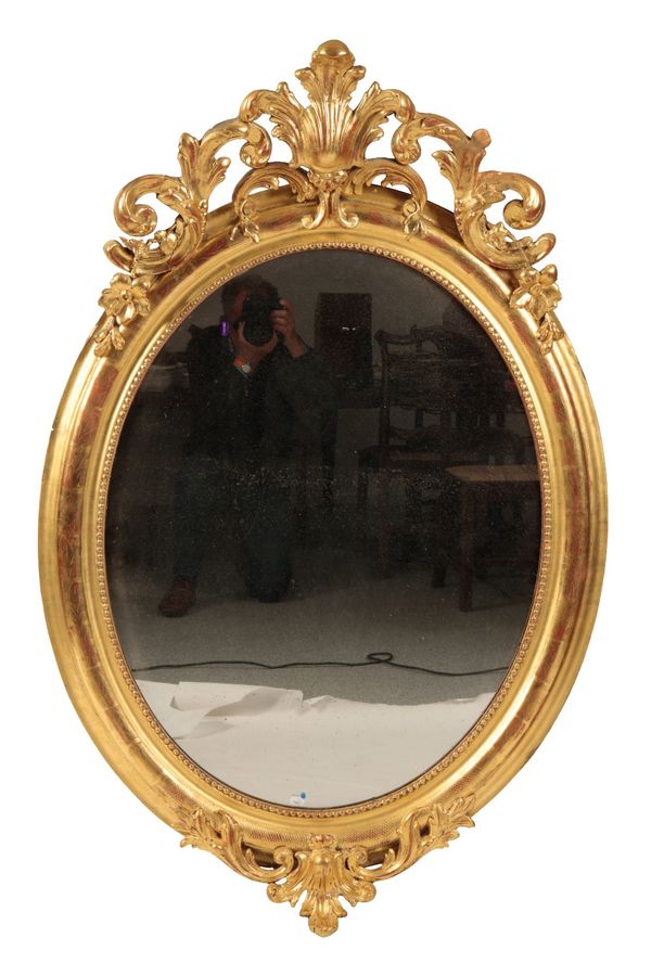 GEORGE III STYLE GILTWOOD OVAL WALL MIRROR