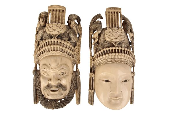 GOOD PAIR OF CARVED IVORY MASKS