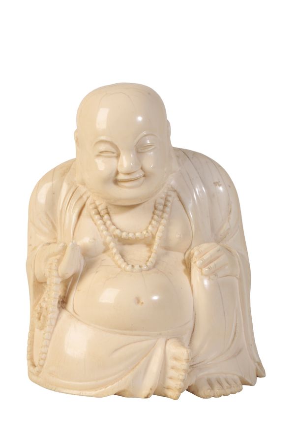 LARGE CARVED IVORY SEATED LAUGHING BUDDHA