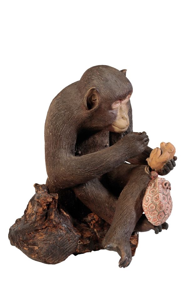 JAPANESE POTTERY FIGURE OF A MONKEY