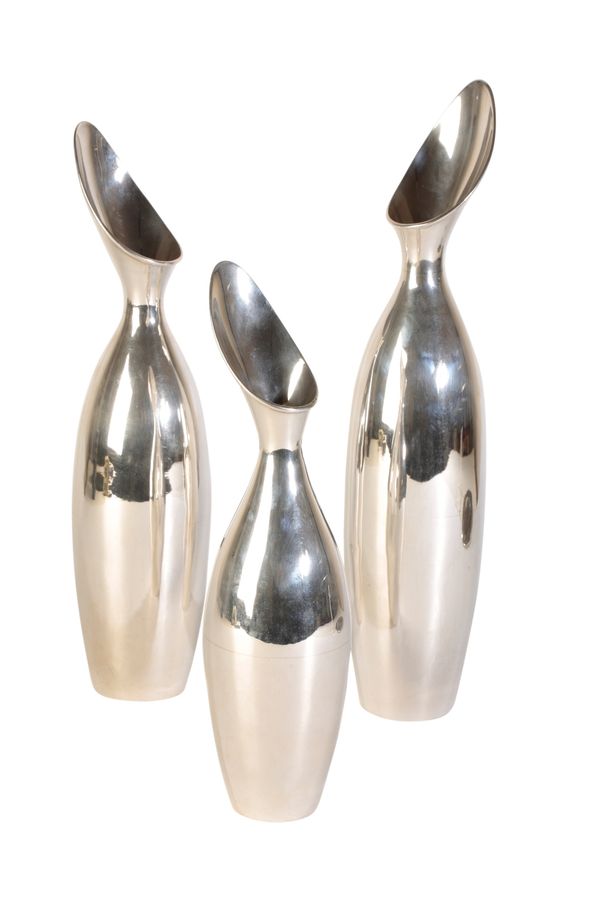 IN THE MANNER OF GEORG JENSEN: A SET OF THREE GRADUATED SILVER VASES