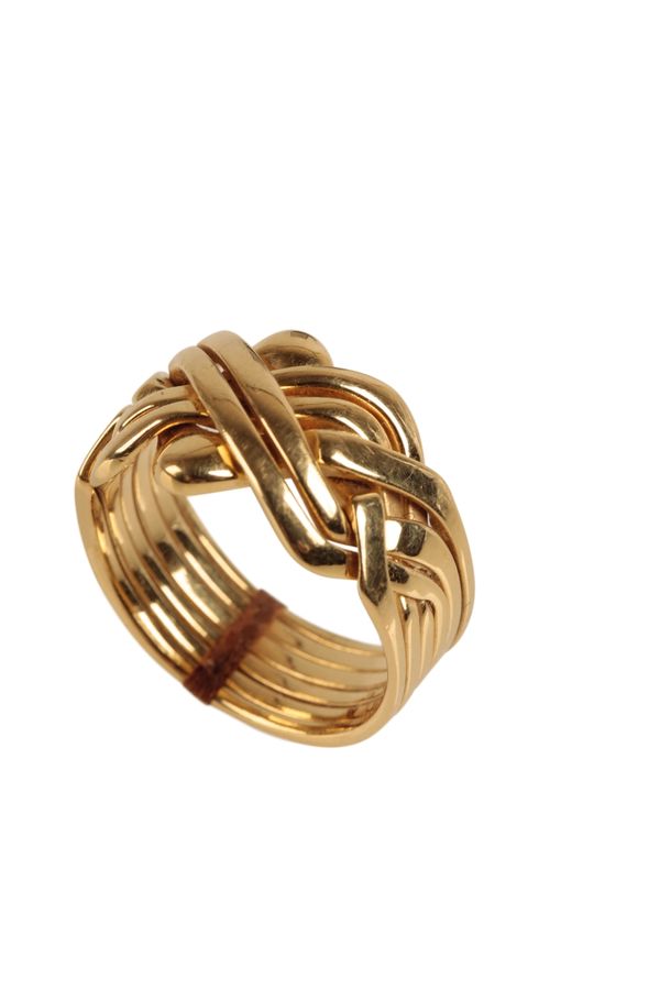 A SOLID GOLD PUZZLE RING