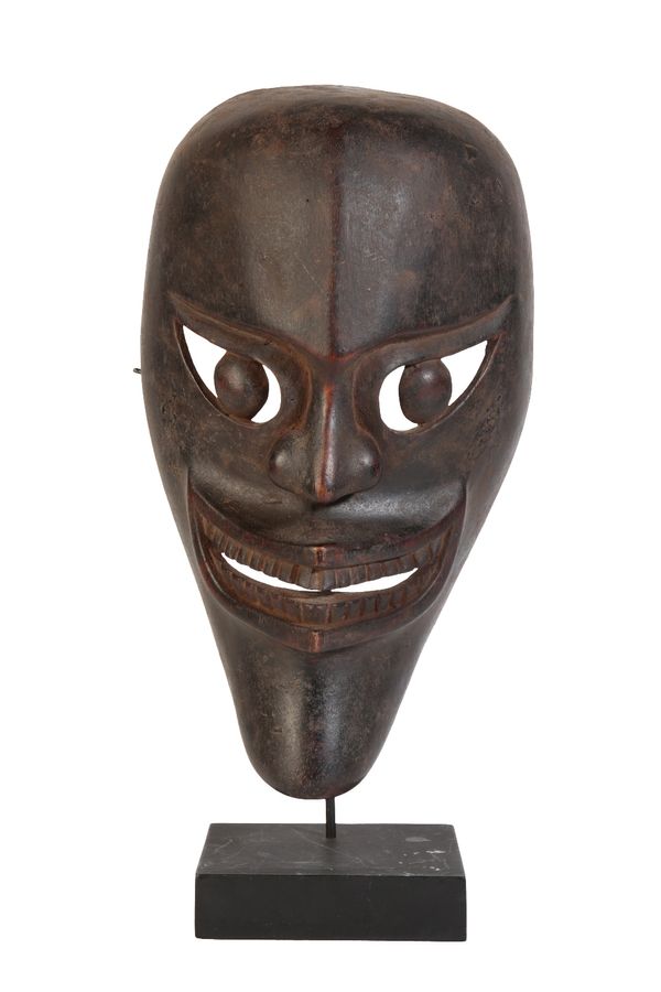 BATAK FINELY CARVED WOODEN MASK ON STAND