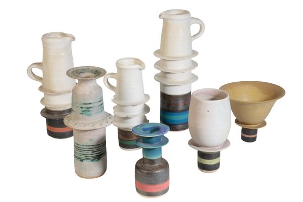 •ALAN ASHPOOL (b.1932): SEVEN "PAGODA" STONEWARE VASES AND JUGS