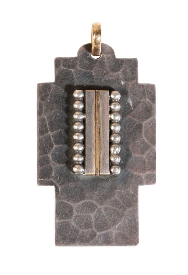 •JEAN DESPRES (1889 - 1980): A SILVER AND GILT METAL CROSS PENDANT