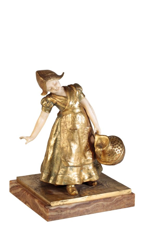 •CHARLOTTE MONGINOT (1872 - 1962); A GILT BRONZE AND IVORY SCULPTURE: "GIRL WITH PAIL"