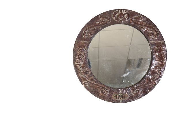 MANNER OF JOHN PEARSON: AN ARTS AND CRAFTS COPPER WALL MIRROR