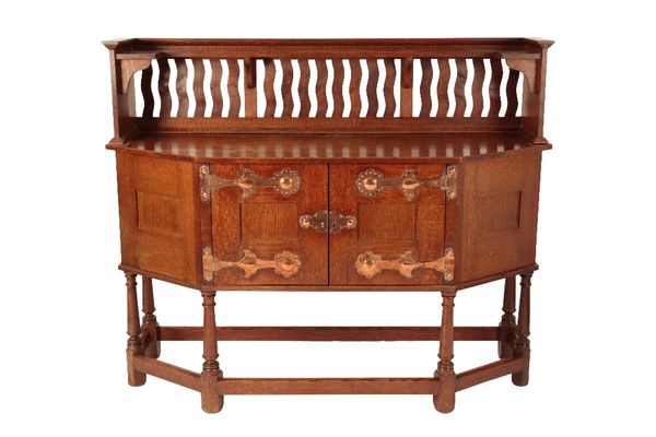 ATTRIBUTED TO LIBERTY & CO: AN ARTS AND CRAFTS OAK SIDEBOARD