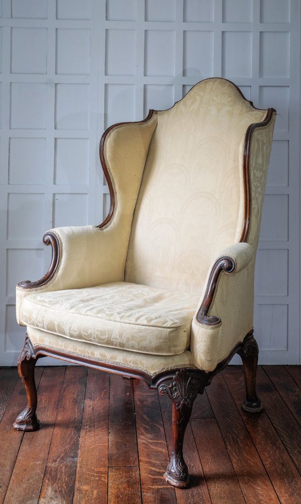 A GEORGE I STYLE WALNUT WING ARMCHAIR