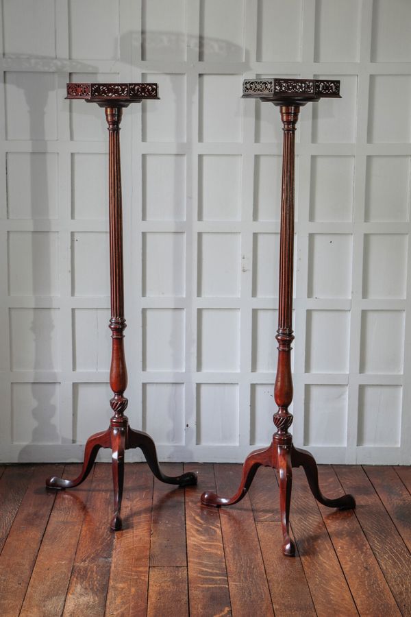 A PAIR OF EARLY GEORGE III MAHOGANY TORCHERES