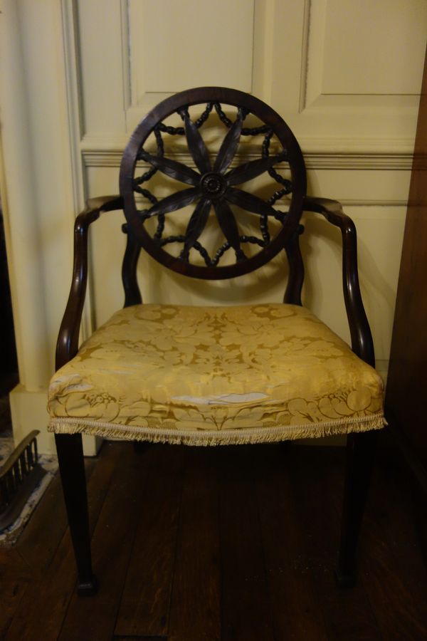 A GEORGE III MAHOGANY ELBOW CHAIR