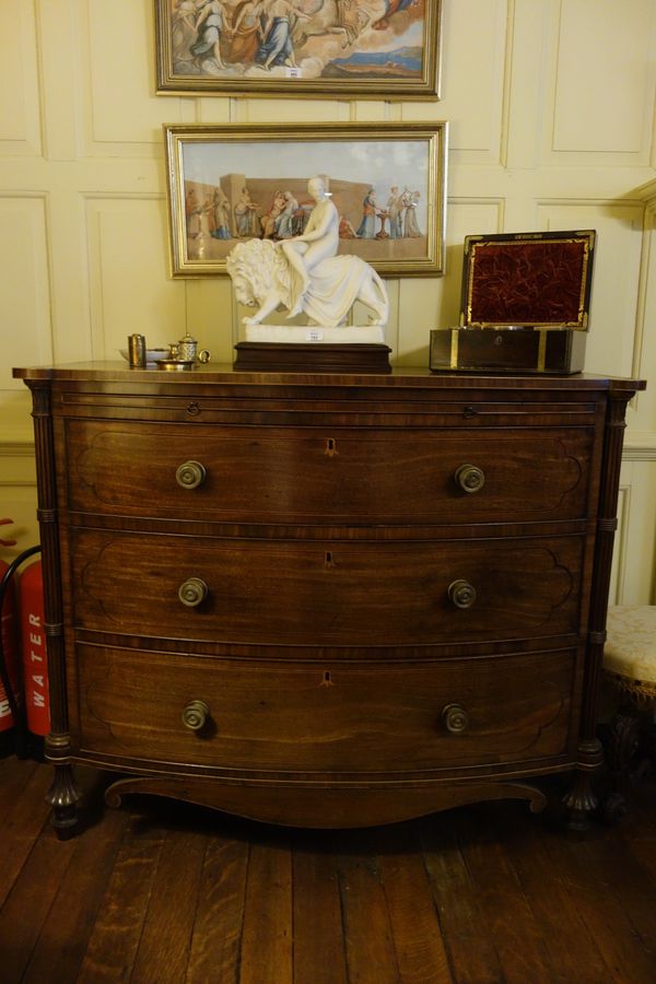 A REGENCY MAHOGANY BOW FRONT CHEST OF DRAWERS