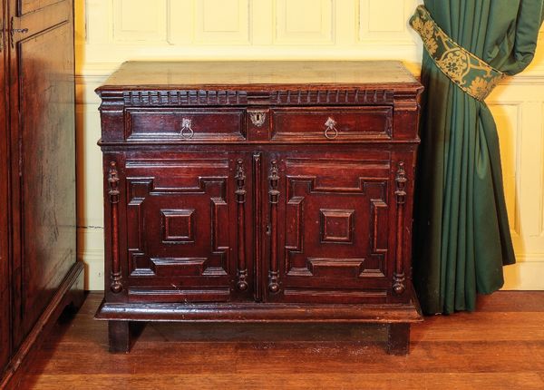 A CHARLES II OAK SIDE CABINET