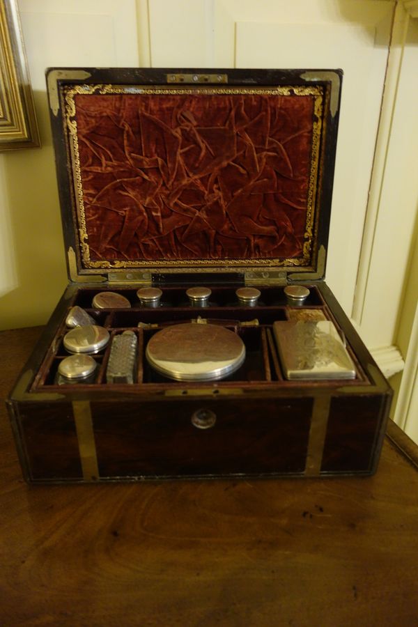 A VICTORIAN BRASS-BOUND ROSEWOOD DRESSING CASE