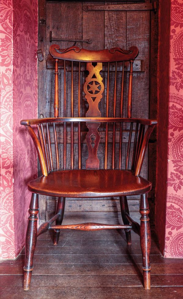 A WILLIAM IV FRUITWOOD AND ELM WINDSOR ARMCHAIR