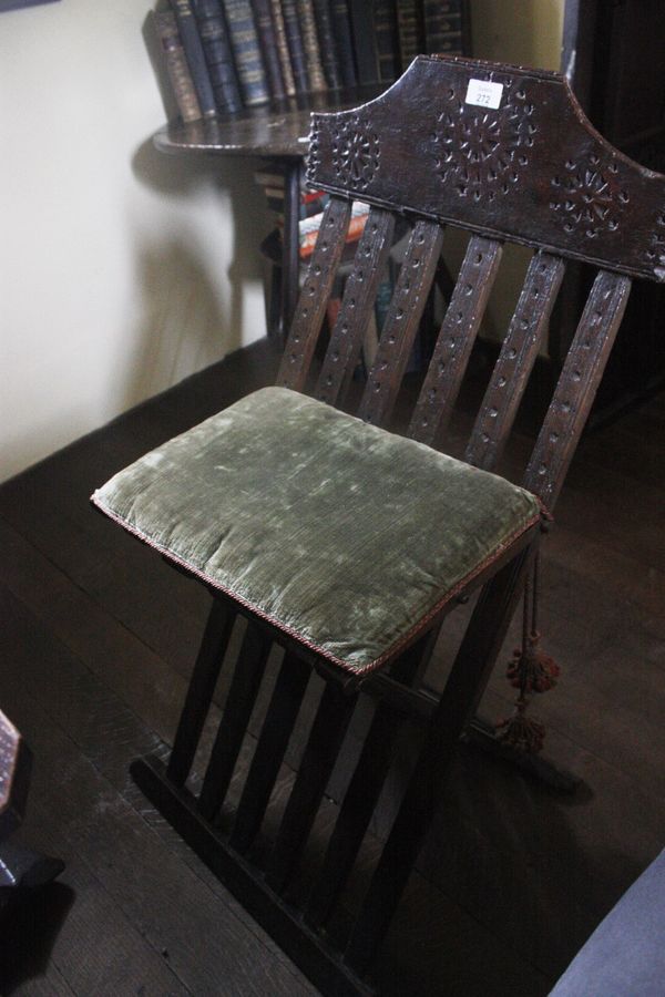 A RENAISSANCE STYLE FOLDING CHAIR