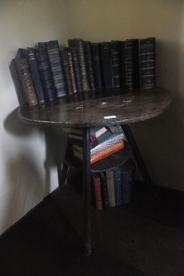 A PRIMITIVE ELM "CRICKET" TABLE