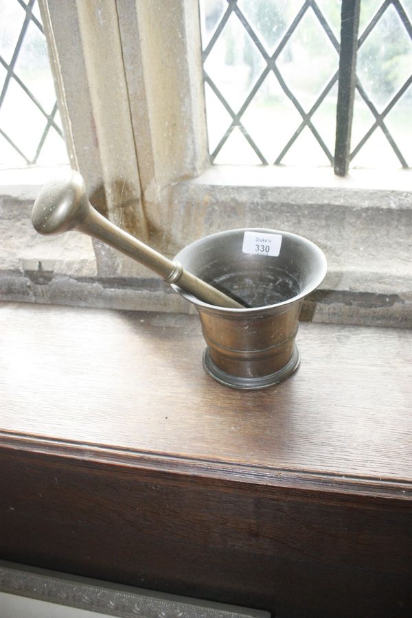 A BRASS PESTLE AND MORTAR