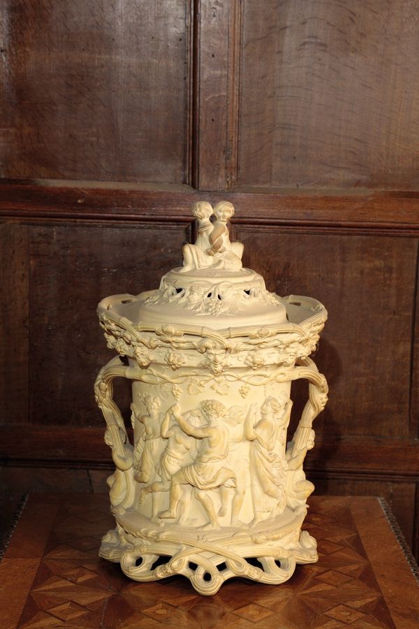 A BISCUIT-COLOURED STONEWARE WINE COOLER