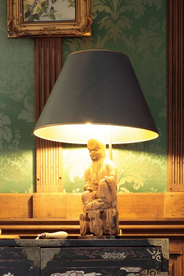 A CARVED WOOD "BUDDHA" TABLE LAMP