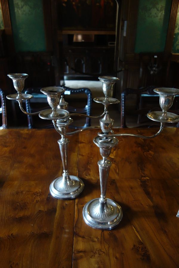 A PAIR OF SILVER PLATED CANDELABRA