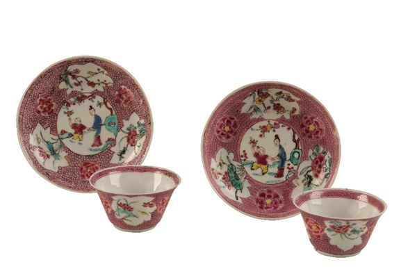 PAIR OF FAMILLE ROSE RED-GROUND 'EGGSHELL' TEABOWLS AND SAUCERS, YONGZHENG / QIANLONG PERIOD