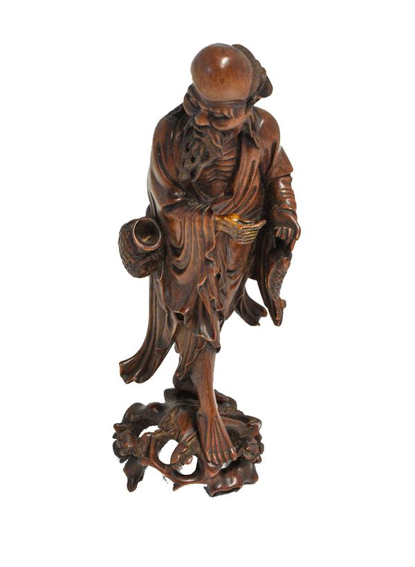 CARVED BOXWOOD FIGURE OF AN IMMORTAL, QING DYNASTY