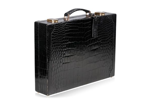 A BLACK CROCODILE BRIEF CASE, RETAILED BY LIBERTY OF LONDON
