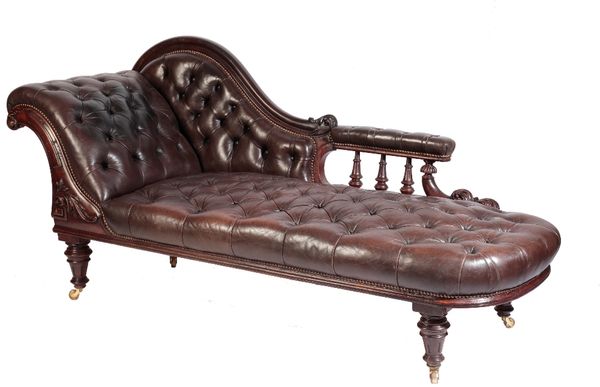 WILLIAM IV CARVED WALNUT AND BUTTONED LEATHER UPHOLSTERED CHAISE LONGUE