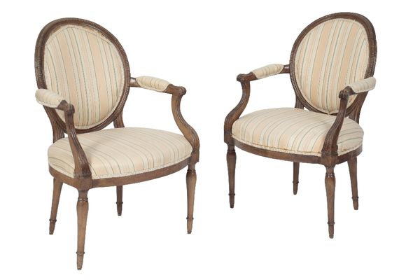 PAIR OF CARVED BEECH AND UPHOLSTERED FAUTEUILS IN LOUIS XVI STYLE