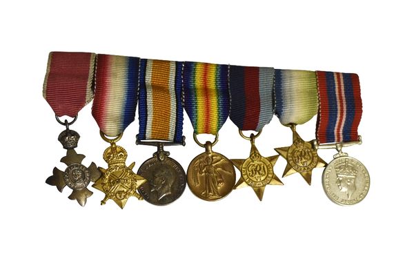 COLLECTION OF MILITARY RELATED BADGES AND MINIATURE MEDALS