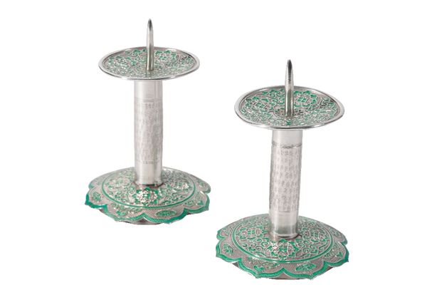 PAIR OF MOORISH SILVERED AND ENAMEL PRICKET CANDLESTICKS