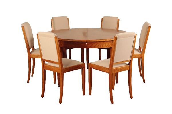 *ATTRIBUTED TO LEON JALLOT: A FRENCH ART DECO SATINWOOD AND BURR ELM DINING SUITE