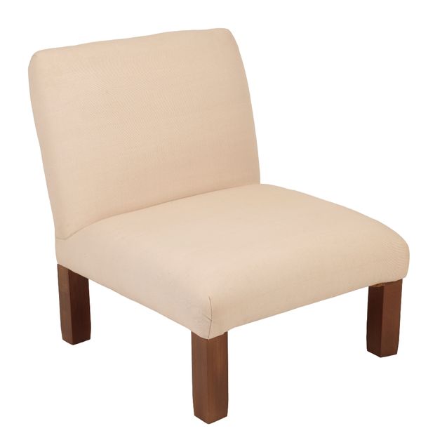 *CHRISTIAN LIAIGRE: A CREAM UPHOLSTERED CHAIR