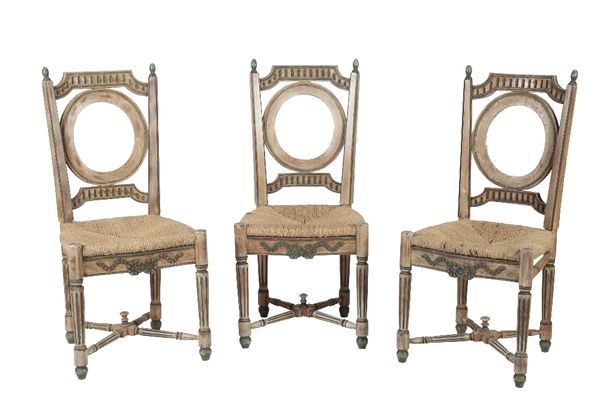 SET OF SIX CONTINENTAL CARVED AND PAINTED BEECH AND RUSH SEATED DINING CHAIRS