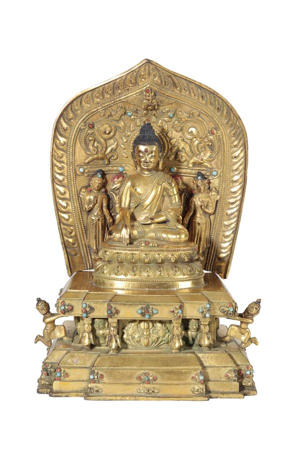 GILT-BRONZE FIGURE OF BUDDHA SHAKYAMUNI ON A STEPPED THRONE, TIBET, 16TH CENTURY OR LATER