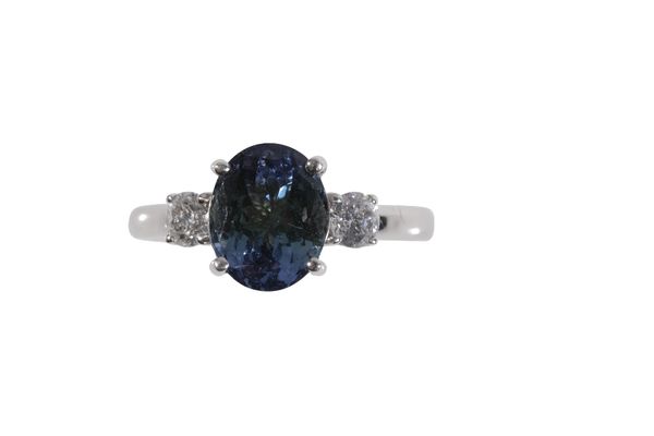 AN 18 CARAT GOLD TANZANITE AND DIAMOND RING