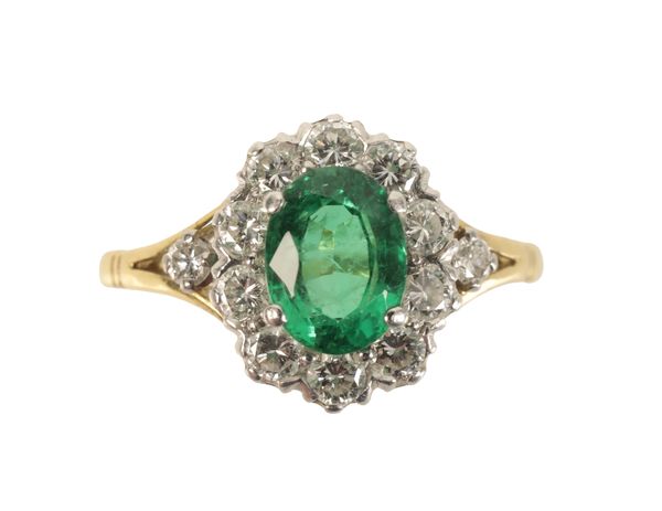 AN 18 CARAT GOLD EMERALD AND DIAMOND RING