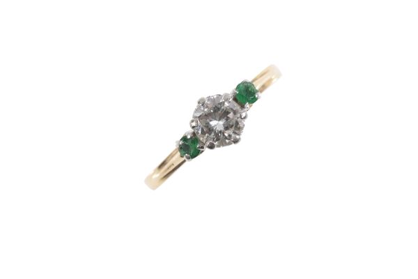 A DIAMOND AND EMERALD RING