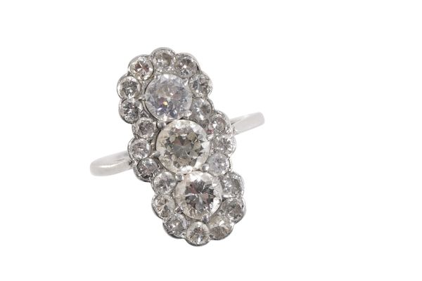 A THREE STONE DIAMOND CLUSTER RING