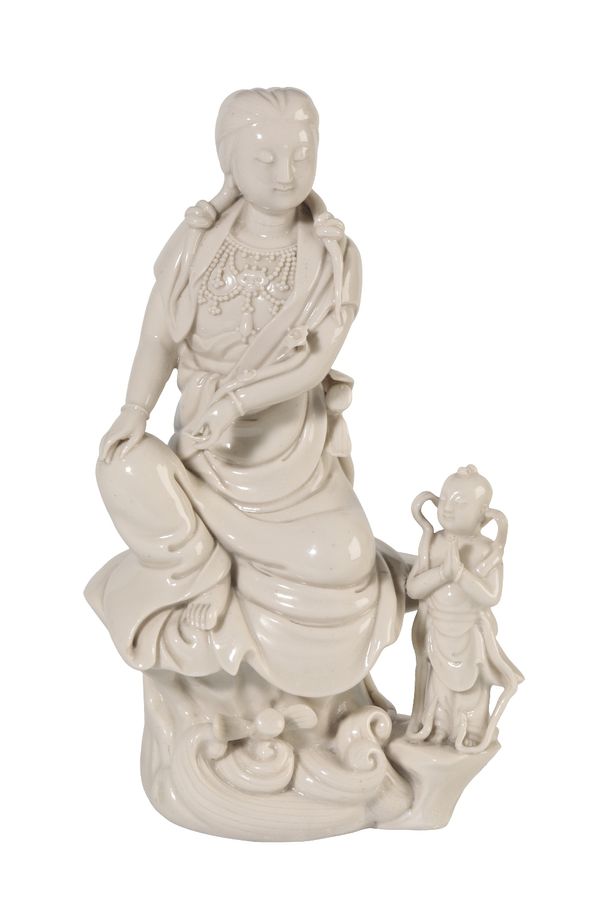 FINE BLANC-DE-CHINE FIGURE OF GUANYIN AND CHILD, QING DYNASTY