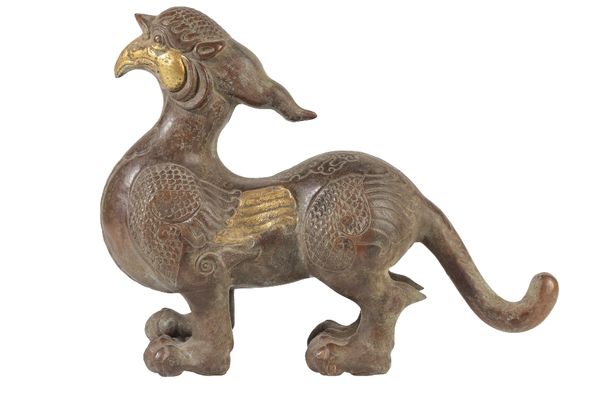 CHINESE BRONZED METAL MYTHICAL WINGED BEAST, IN THE ARCHAIC STYLE