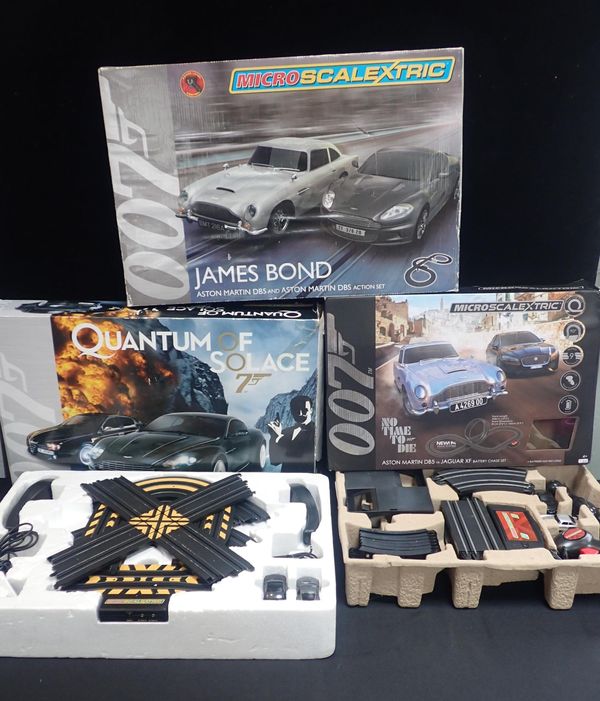 THREE 'JAMES BOND 007' MIRCO SCALEXTRIC SETS