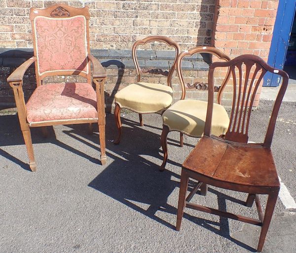 AN EDWARDIAN OAK ART NOUVEAU  ARMCHAIR